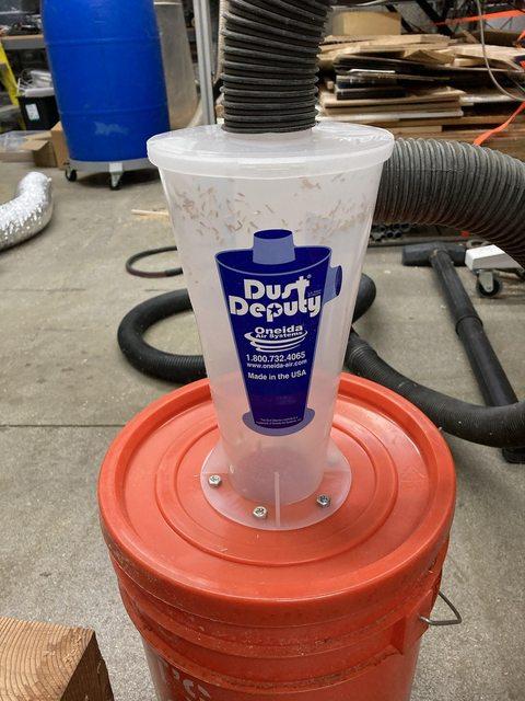 red bucket with dust cyclone